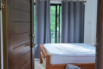 Open of wooden teak door in modern house interior style room