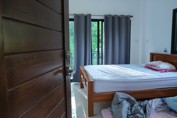 Open of wooden teak door in modern house interior style room