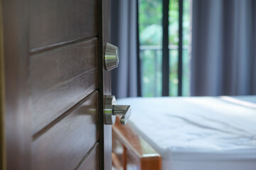 Open of wooden teak door in modern house interior style room