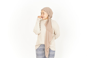 Smelling something stinky and disgusting of Beautiful Asian Woman Wearing Hijab Isolated On White Background - obrazy, fototapety, plakaty