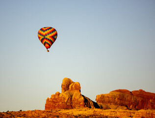 hot air balloon at sunrise over utah