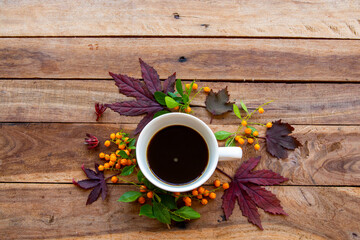 hot coffee espresso with mable leaf in autumn season arrangement flat lay postcard style on background wooden