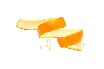 Orange essential oil drop dripping from orange peel isolated on white background.