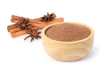 anise and cinnamon powder on white