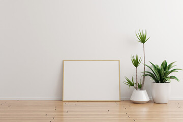 Horizontal wooden photo frame mockup on white wall empty room with plants on a wooden floor