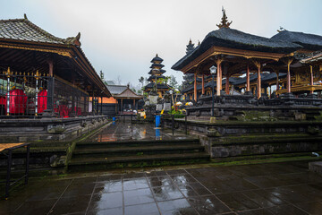 Naklejka premium Altars in the Pura Besakih temple on Bali island in Indonesia at a rainy day