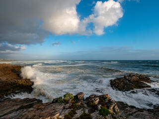 Large ocean swells crashing into rocky shoreline at Siever's Point. Hermanus. Whale Coast. Overberg. Western Cape. South Africa
