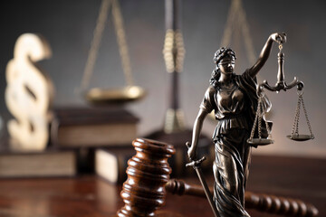 Lawyer office. Law symbols composition: judge’s gavel, Themis sculpture, paragraph sign and scale. © zolnierek