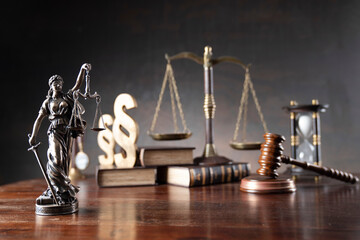 Lawyer office. Law symbols composition: judge’s gavel, Themis sculpture, paragraph sign and scale. - obrazy, fototapety, plakaty