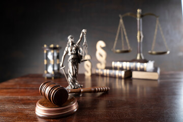 Lawyer office. Law symbols composition: judge’s gavel, Themis sculpture, paragraph sign and scale. - obrazy, fototapety, plakaty