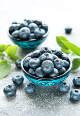 Freshly picked blueberries on a concrete background. Concept for healthy eating