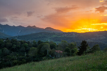 Naklejka na ściany i meble Mountain landscape in the Picos de Europa National Park in a beautiful sunset