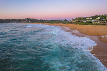 Obraz na płótnie Canvas Surfs up aerial sunrise seascape