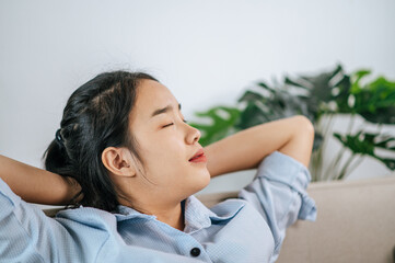 Young woman relax on sofa after work finished