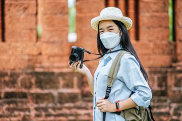 Young backpacker female travel in historic site