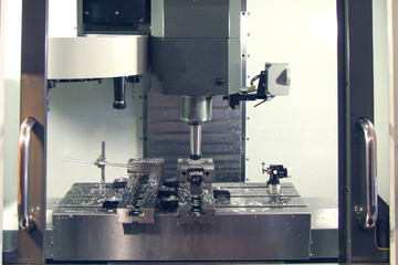Drilling cutting metalworking process. Precision industrial CNC machining of metal detail by mill at factory