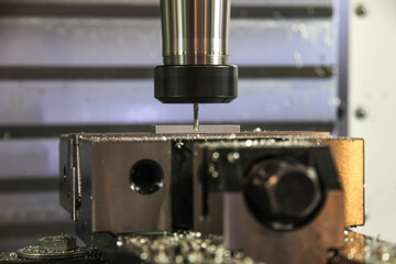 Drilling cutting metalworking process. Precision industrial CNC machining of metal detail by mill at factory