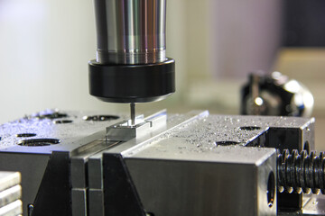 Drilling cutting metalworking process. Precision industrial CNC machining of metal detail by mill at factory