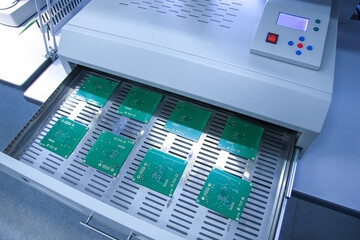Infrared soldering oven. Production and assembly of printed circuit boards in a factory.