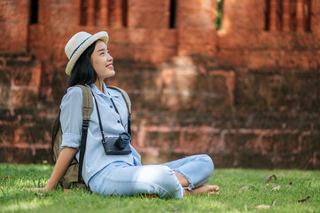 Fototapeta premium Young backpacker female travel in ancient site
