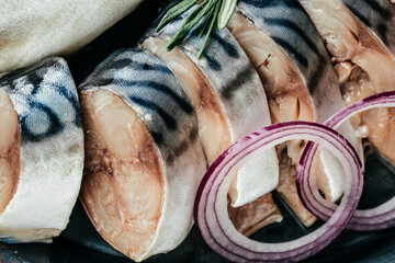 appetizer of slightly salted mackerel fish slices with onion. Food recipe background. Close up