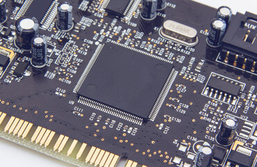 Selective focus. Close up photo of black printed circuit board with dip components. LED diods, resistors, capasitors and processor on the background