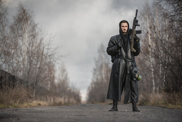 Concept of post apocalypse survivor with a rifle. - obrazy, fototapety, plakaty
