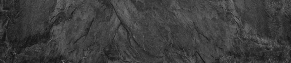 Gray grunge banner. Abstract stone background. The texture of the stone wall. Close-up.