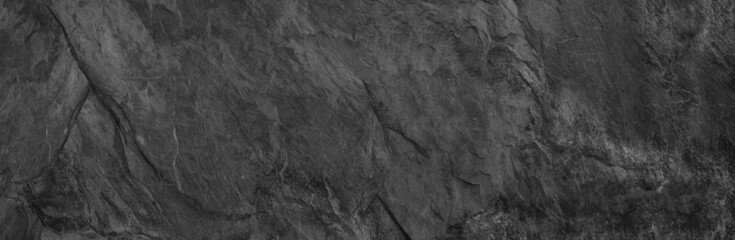 Gray grunge banner. Abstract stone background. The texture of the stone wall. Close-up.