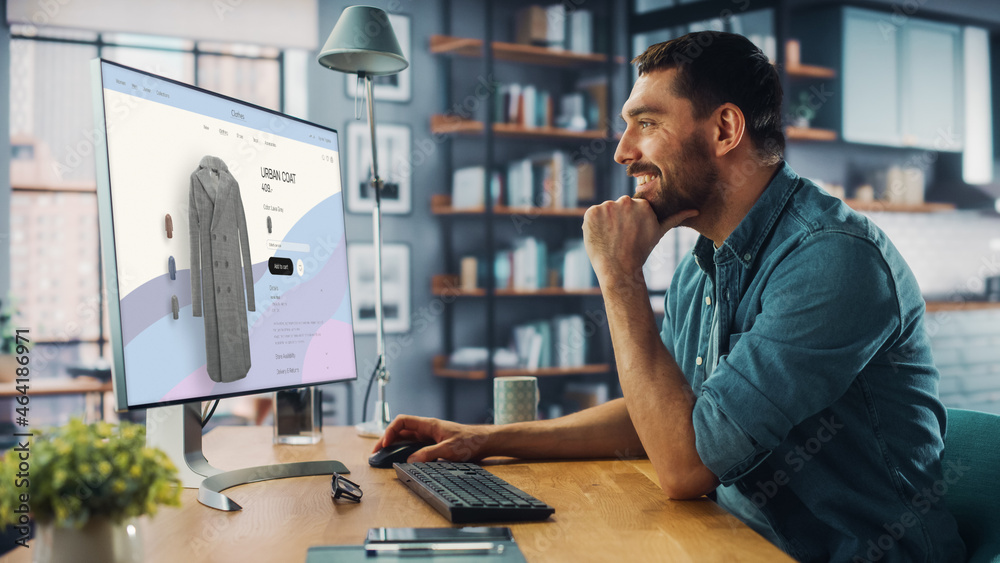 Poster Handsome Caucasian Specialist Using Desktop Computer with Clothing Online Web Store to Choose and Buy New Stylish Coat. Happy Man Browsing Over the Internet at Home Living Room.