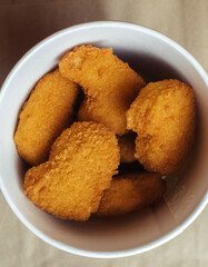 Close-up of chicken nuggets Fast food in batter. Meal preparation restaurants and cafes. Classic American cuisine concept.