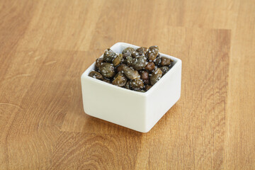 Salted marinated capers snack appetiser