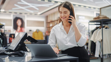 Modern Clothing Store: Friendly Customer Support Specialist Talks to Client on the Smartphone....