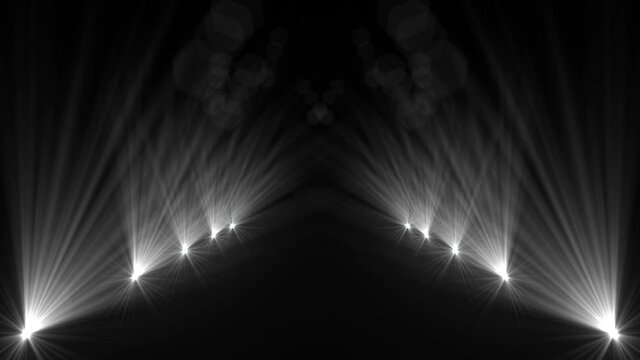 Animation of stage lights path.Bright shiny entertainment spot light in the dark.