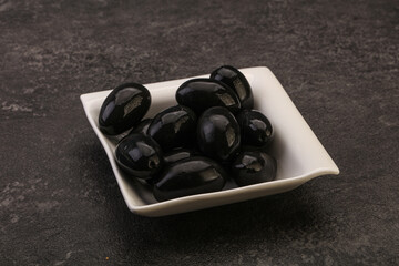 Pickled black olives in the bowl