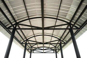 Black steel roof structure on white background.