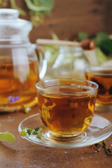 Hot herbal tea with chamomile and honey on wooden background 