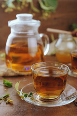 Hot herbal tea with chamomile and honey on wooden background 