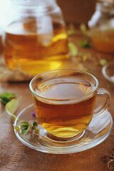 Hot herbal tea with chamomile and honey on wooden background 
