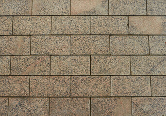 Cobblestone pavement texture background. Top view of stone road. Detail of granite sidewalk taken from above. Old street cobblestones for backdrop. Abstract vintage pavement with rough blocks.