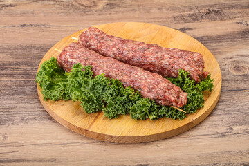 Raw minced beef kebab skewer