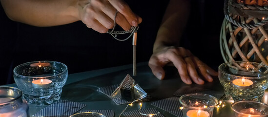 Tarot cards, Fortune telling on tarot cards at night by candlelight, magic crystal, occultism,...