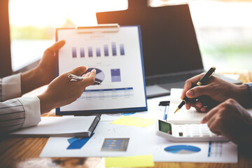 Team work with business analytic price chart on the table at the conference room.
