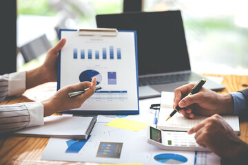 Team work with business analytic price chart on the table at the conference room.