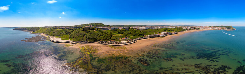 Naklejka premium Aerial panoramic photo of the seaside village of Filey in the UK showing a wide view image of the sea front and coastal hotels in the summer time