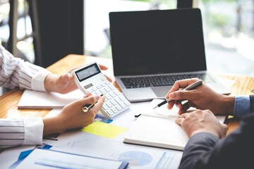 Team work with business analytic price chart on the table at the conference room.