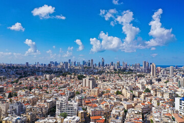 Tel Aviv skyline over neighboring Bnei Brak lower houses, Aerial view.