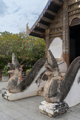 View of ancient naga staircase entrance to beautiful Lanna style viharn at historic Wat Prasat...