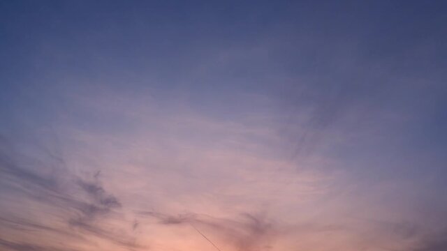 4K Sky Time lapse, Beautiful background, Sky Timelapse of skyscrapers. Romantic colorful sunset. Sun go down, blue and orange clouds flow in sky. Majestic summer landscape. Exploring beauty world, tr