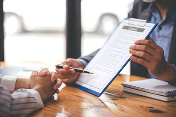 business people negotiating contracts with the documents on the table and sign the contract